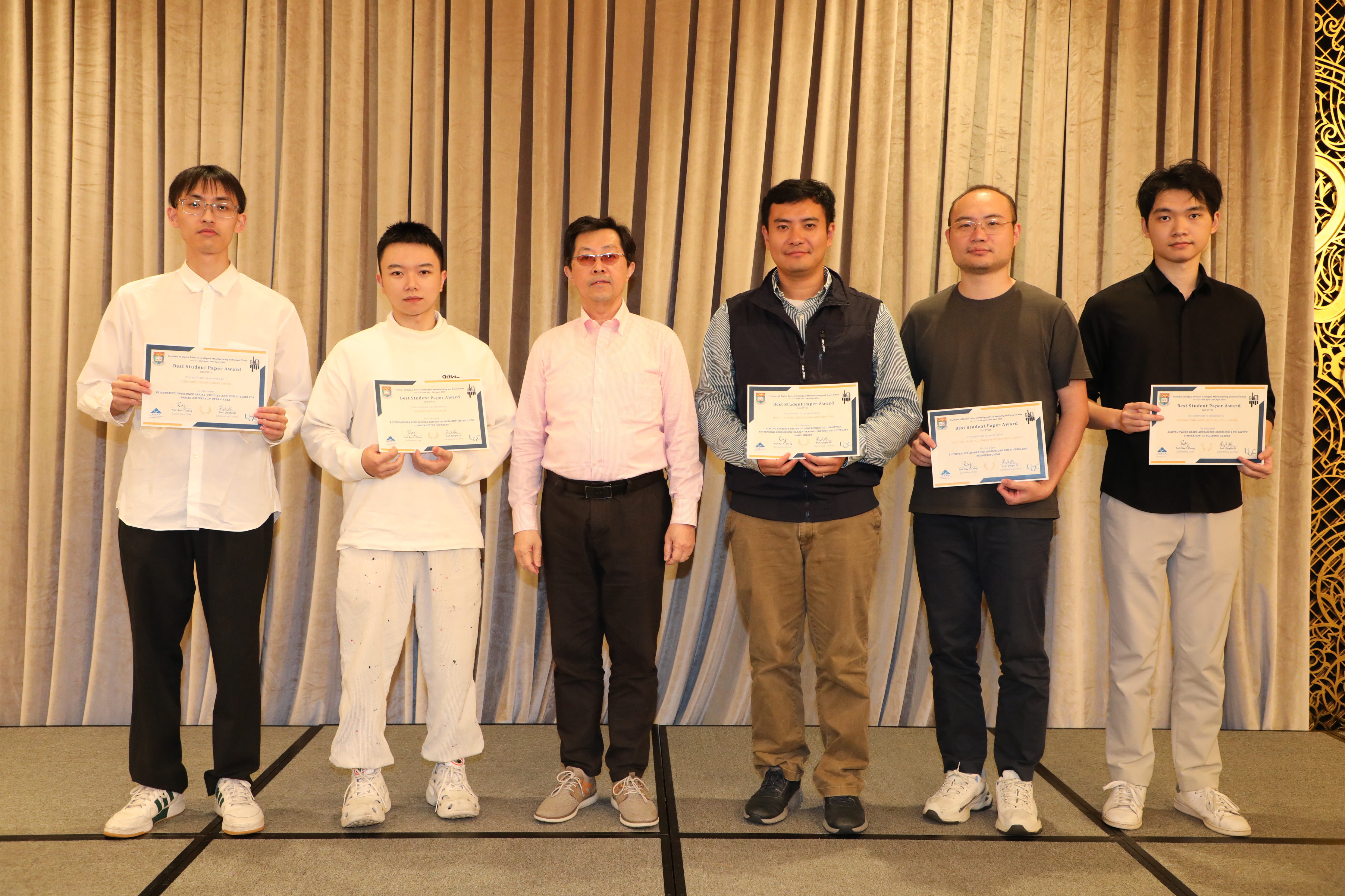 Mr. Minshan Xie (second from left) receiving his best student paper award