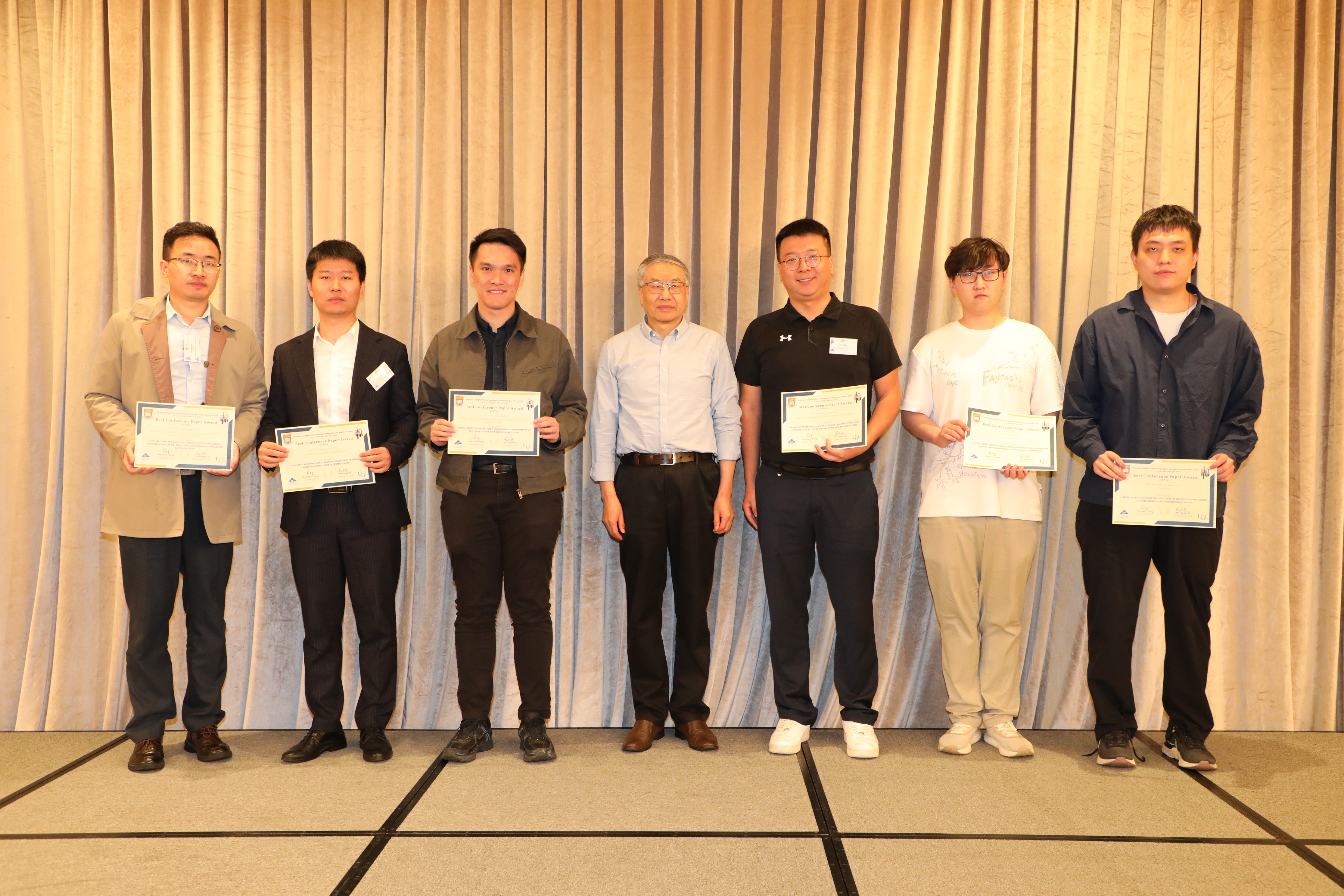 Mr. Zhenyu Liang (third from left) receiving his best conference paper award
