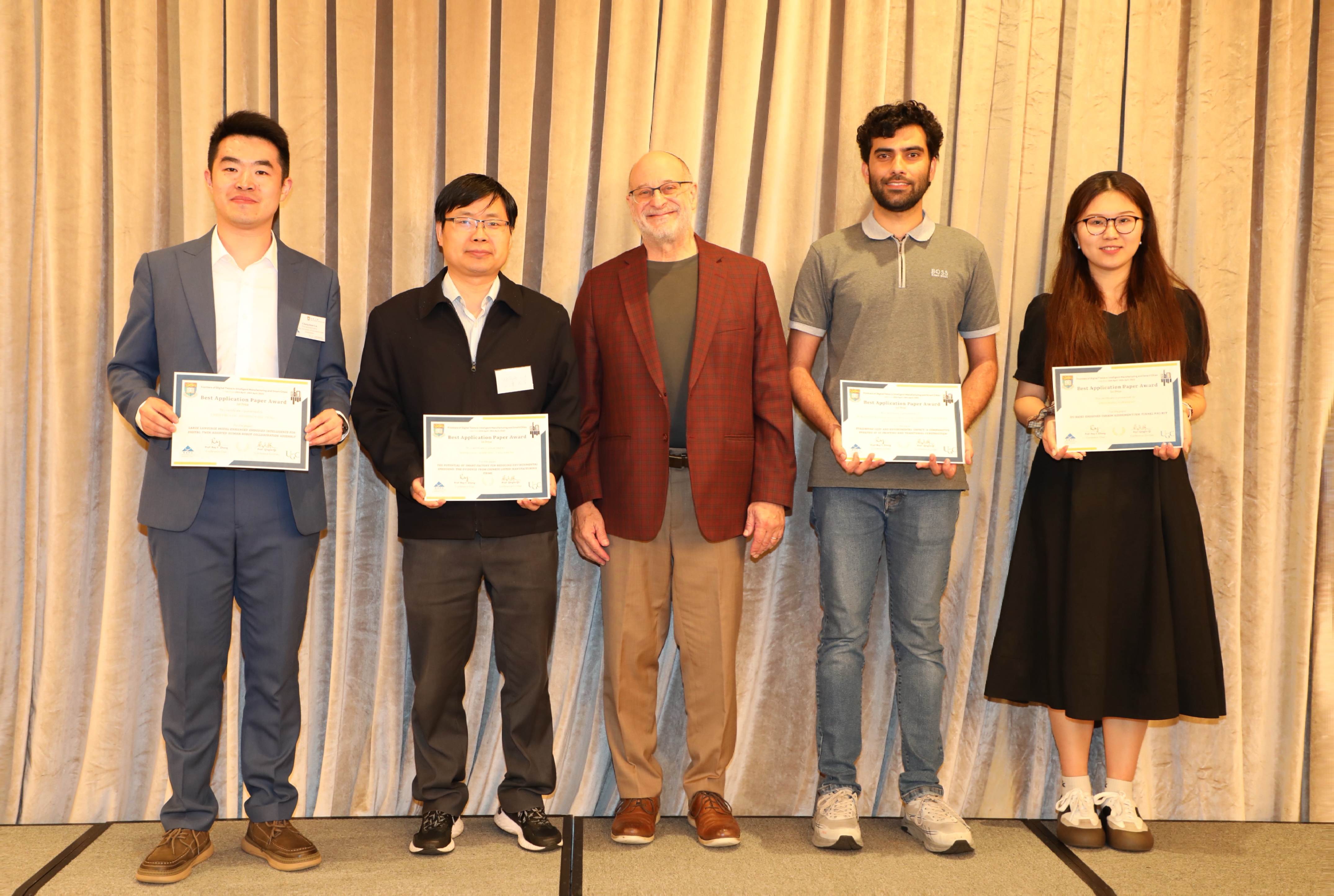 Ms. Yirui Wang (first from right) winning the best application paper award