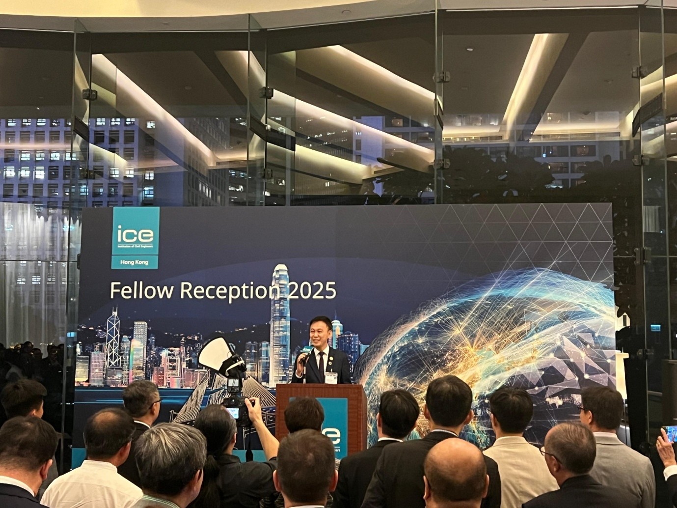 Dr. Johnny Cheuk addressing attendees at the reception